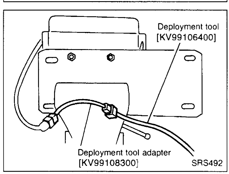 Deployment tool [KV99106400] connected via deployment tool adapter [KV99108300] to the connector on the side air bag module (held in bracket).
