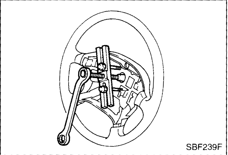Steering wheel puller installed on the steering wheel — for removing the wheel after the airbag and centre nut are removed.