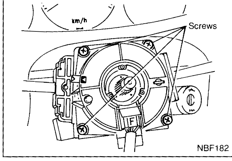 Steering column with steering wheel removed showing the spiral cable in place — four screws hold it on, and the harness must be disconnected before removal.