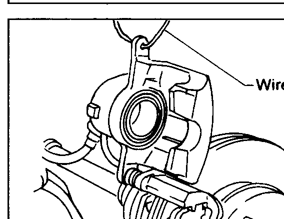 Front caliper from outboard side. Arrows point at the lower guide pin bolt that must be removed to swing the cylinder body upward.