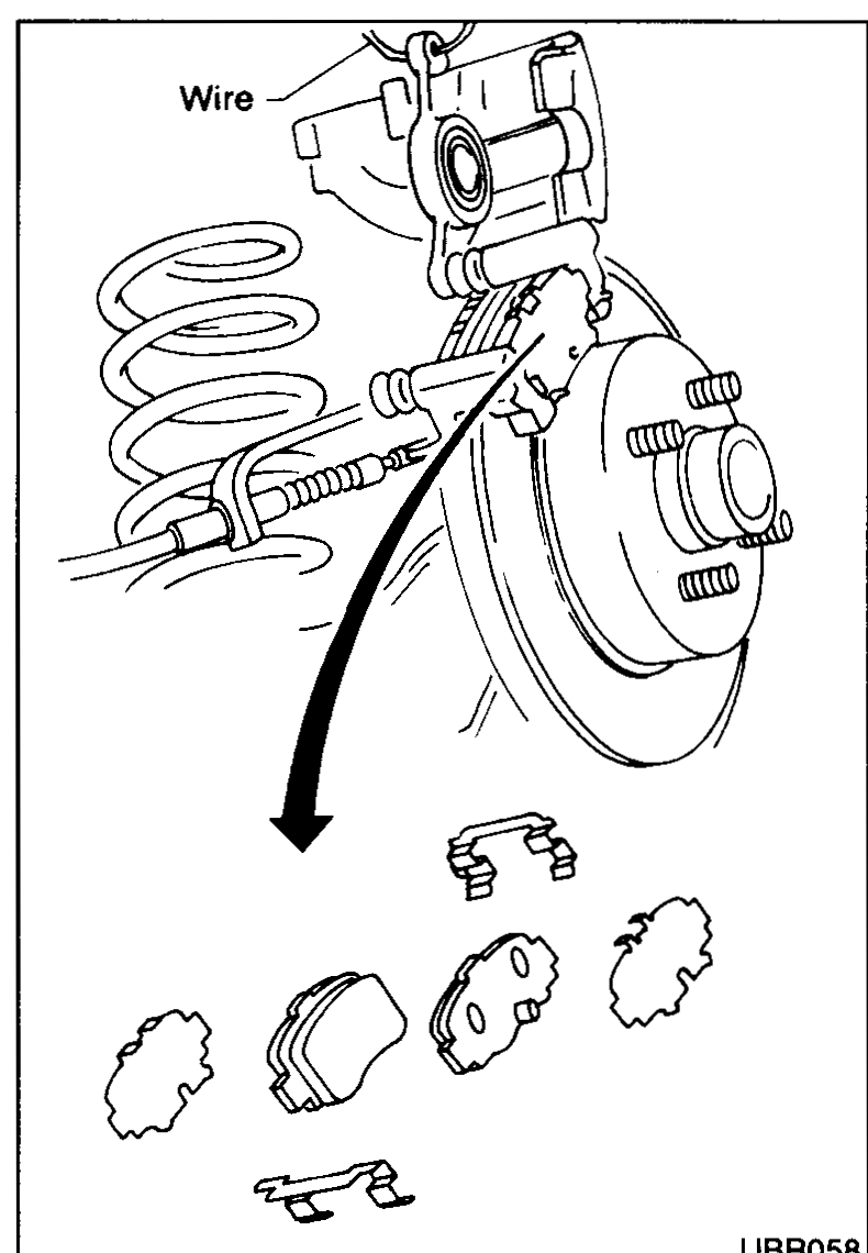 Cylinder body opened upward and suspended by wire; below the rotor, pad retainers and shims laid out.