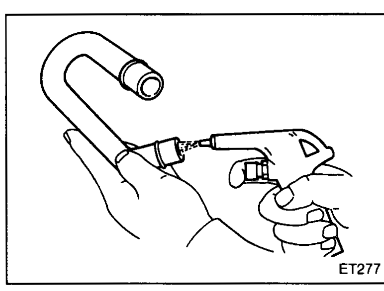 Cleaning ventilation hose with compressed air.