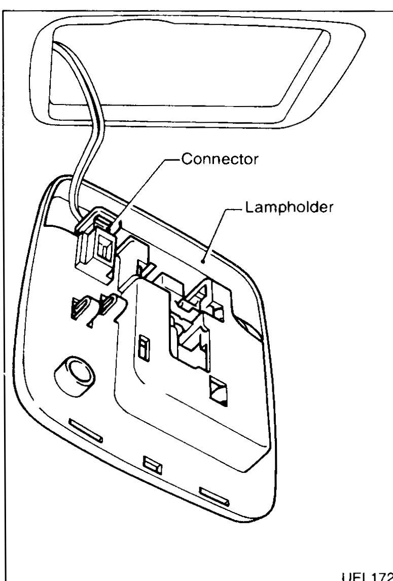 Room lamp assembly with lens removed showing the connector and lampholder, illustrating screw locations for removal.
