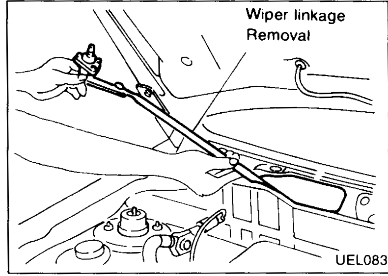 Wiper linkage removal — linkage being pulled out of the linkage channel in the cowl area.