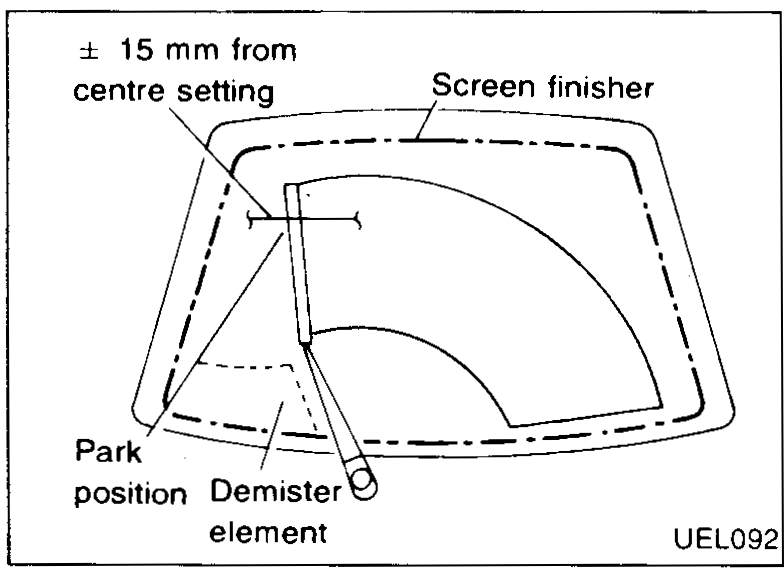Hand prising the rear wiper arm off the drive pivot splines.