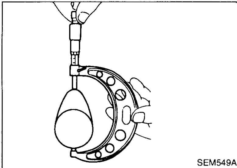 Camshaft mounted between V-blocks with a dial indicator on the centre journal to measure runout.