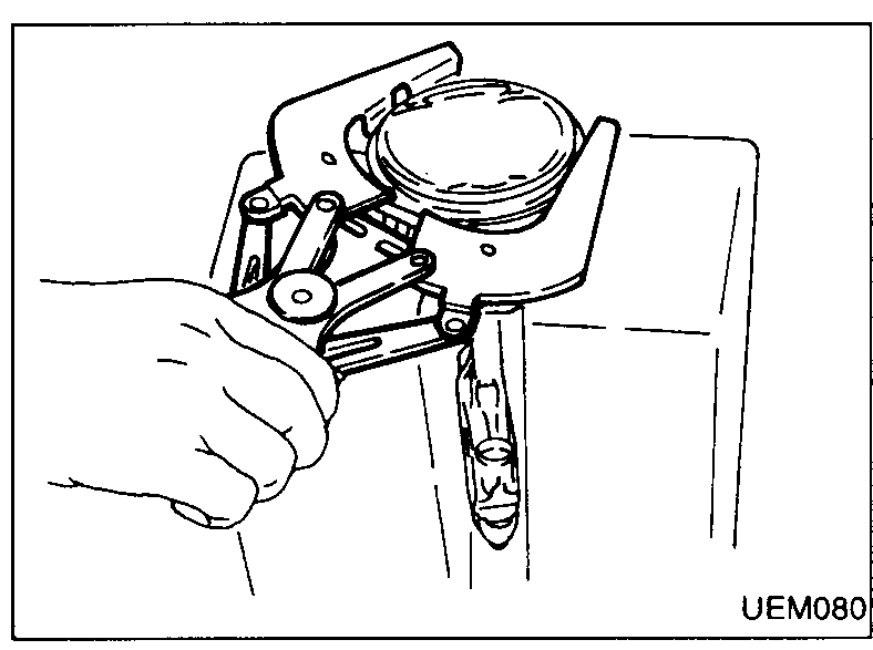 Cylinder block in inverted/horizontal position on the stand showing connecting-rod big-end caps. Hand using a wrench to remove the connecting rod bearing cap nuts.