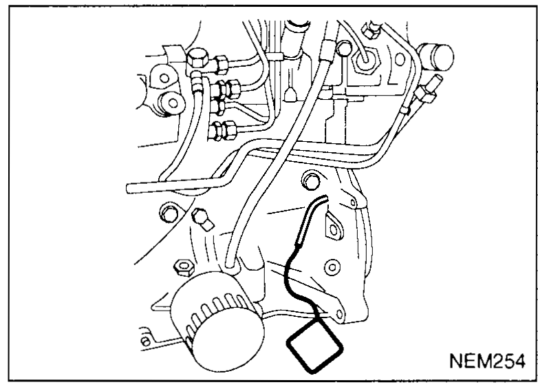 View of the flywheel area through the access hole, showing the KV109B0112 flywheel locking pin engaged — illustrates step 10 (lock crankshaft at TDC).