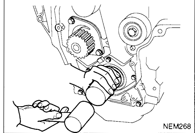 Hand using a tubular driver to seat a new crankshaft front oil seal onto the crankshaft — illustrates crankshaft-front-oil-seal step 3.