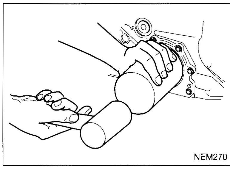 Hand using a tubular driver to seat a new crankshaft rear oil seal — illustrates crankshaft-rear-oil-seal step 4.