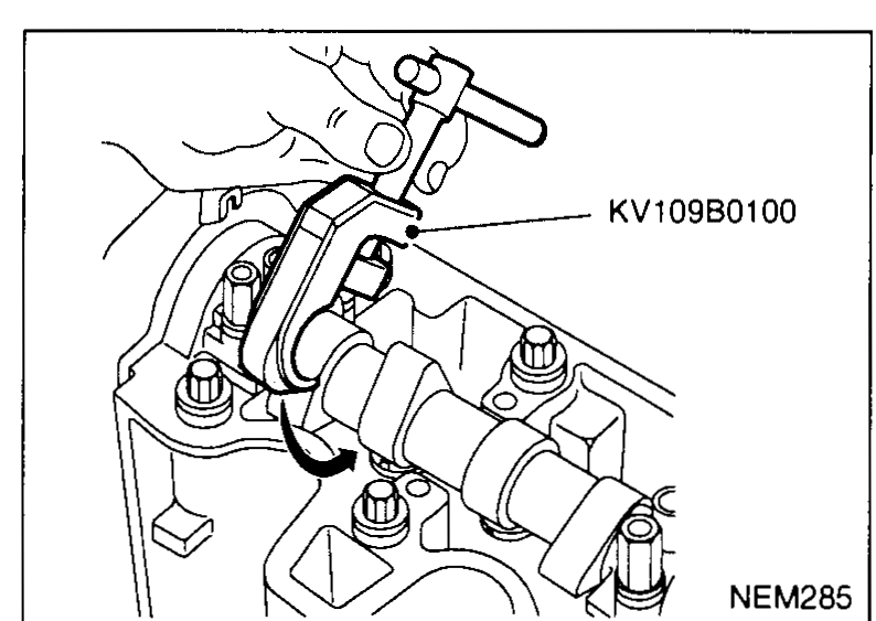 Cylinder head with rocker cover removed; SST KV109B0100 valve-clearance adjustment tool fitted around the camshaft, positioned for engagement with a valve lifter — illustrates Adjusting step 2.
