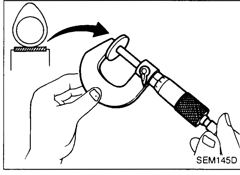 Hand using a small screwdriver and a magnetic finger probe to pry the adjusting shim out of the valve lifter pocket while the lifter is held down — illustrates Adjusting step 4.