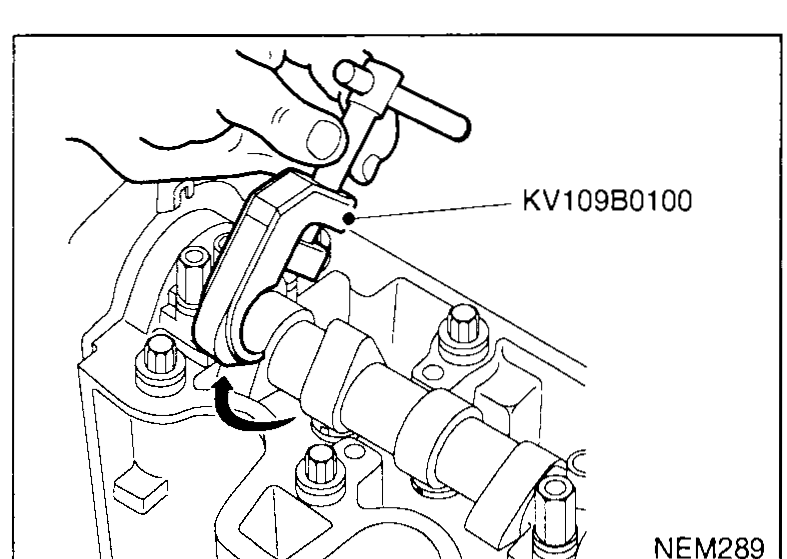 Cylinder head with rocker cover removed; hand removing SST KV109B0100 valve-clearance adjustment tool from around the camshaft after the shim has been replaced — illustrates step 7.