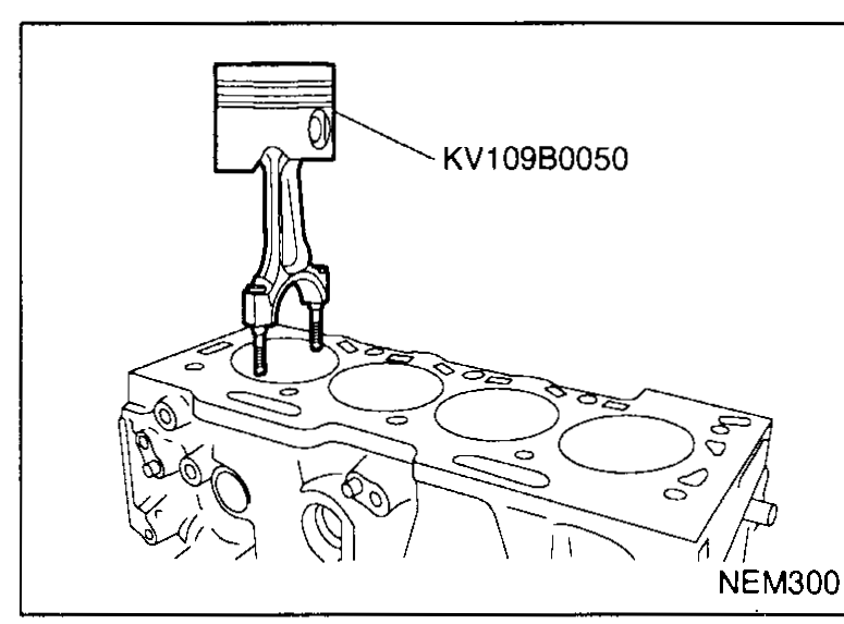 Hands using a micrometer to measure the outer diameter of a piston pin — illustrates Connecting rod clearance (Small end) step 2 (measure piston pin OD).