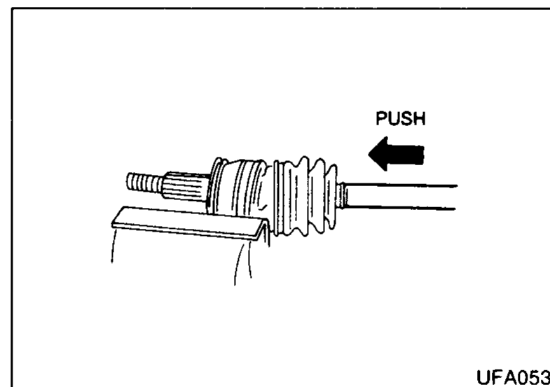 Wheel-side CV joint with boot installed; arrow labelled 'PUSH' showing the shaft being pushed into the joint housing while aligning the matching marks until the circlip seats.