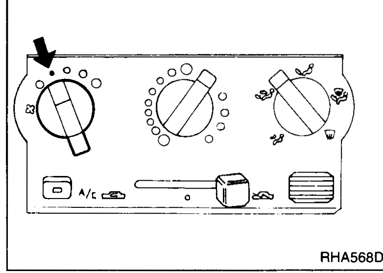 A/C control panel close-up with an arrow pointing at the fan-switch dial on the left, illustrating the blower-check procedure.
