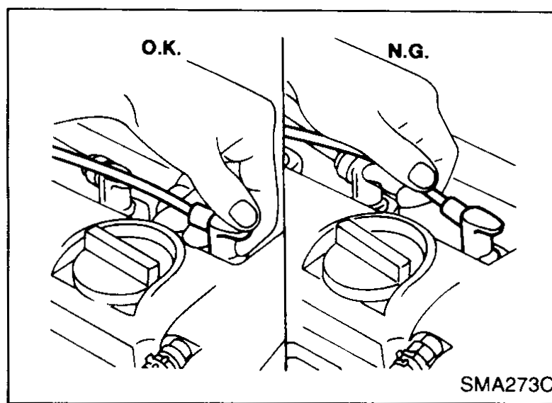 Bottom view of an oil filter showing an arrow indicating to tighten 2/3 of a turn after slight resistance is felt.