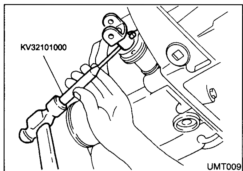 Installation of the differential oil seal using a drift/installer (labelled 'Drift') being driven into the seal bore of the transaxle housing.