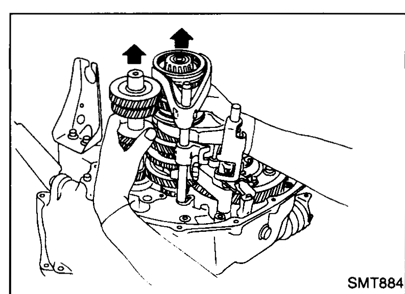 Mechanic raising both the input shaft and mainshaft slightly out of the case (upward arrows). The final-drive assembly remains in the case.