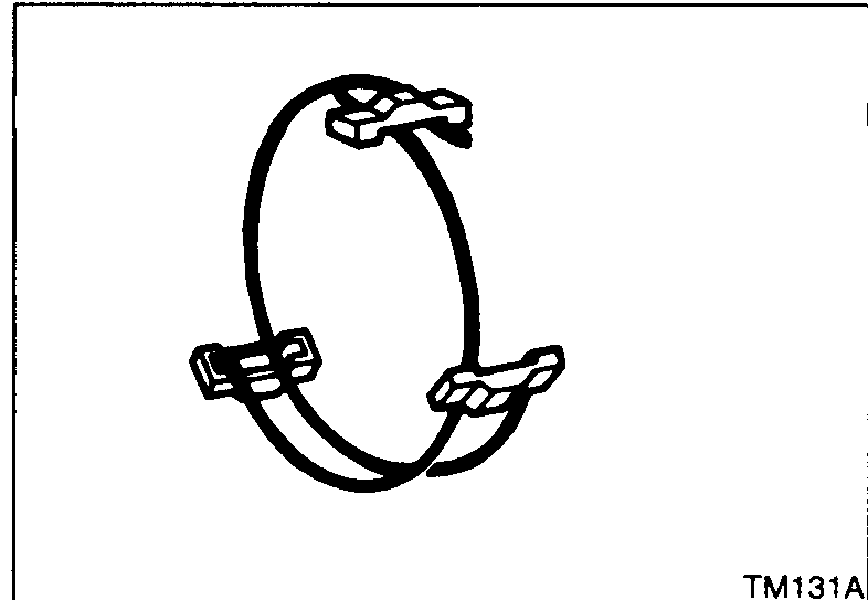 Spread spring shown wrapped around three shifting inserts. Caution: do not hook the front and rear ends of the spread spring on the same insert.
