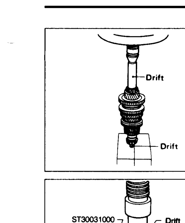 Press setup using two drifts (one above mainshaft, one below the bearing) to press the mainshaft front bearing onto the shaft.