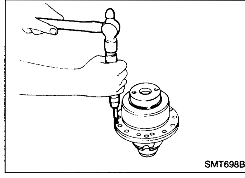 Special tool ST30031000 (press splitter) supporting the differential case under the side bearing; drift on top presses out the differential side bearing.