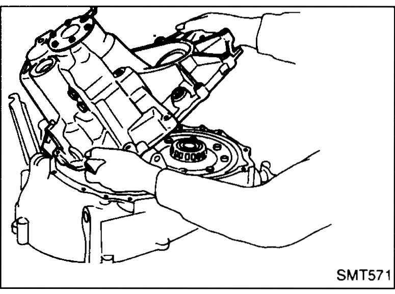 Mating surface of clutch housing showing bead of sealant applied continuously around the perimeter and bolt-hole bosses.