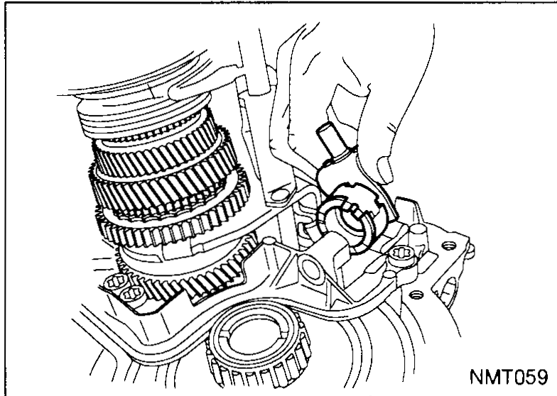 Engagement shaft being lifted out of the transaxle, with a curved arrow indicating the upward removal direction. The compressed spring and seal sit above the gear stack.
