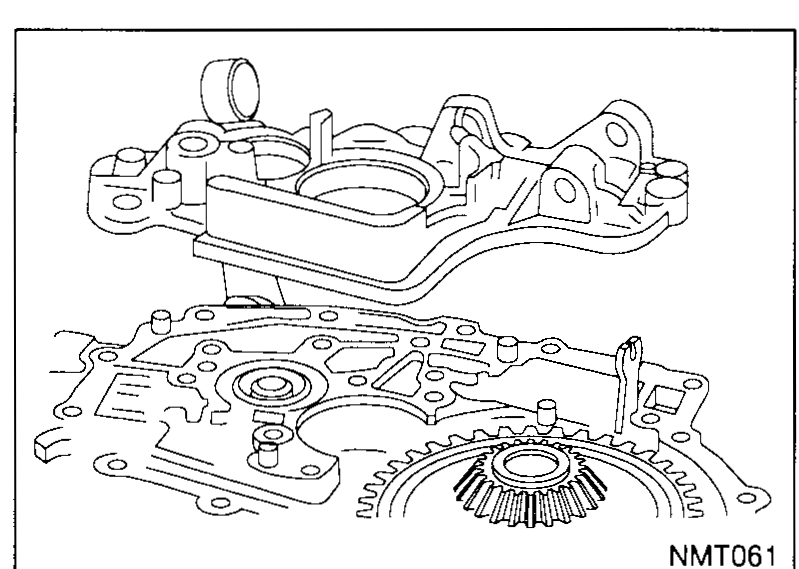 Intermediate plate being lifted from the transaxle housing, exposing the final-drive ring gear underneath.