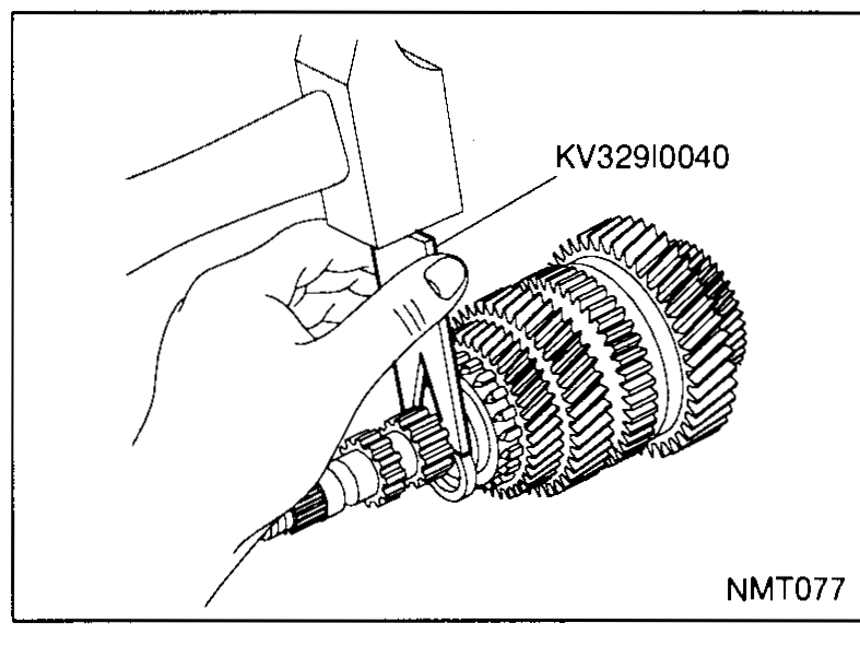 Exploded view showing the washer, 4th gear, synchronizer ring, 3rd/4th synchronizer assembly and mainshaft separated on the bench.