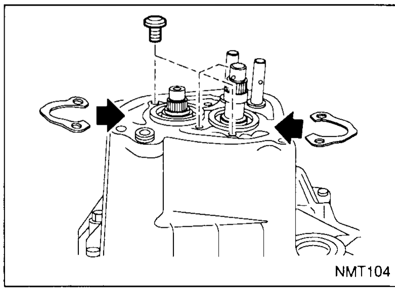 Top of the transaxle case showing two bearing retainers being installed; each retainer is a flat plate with two pre-coated bolts shown floating above. Black arrows point down at each retainer's seated position, indicating chamfer-to-top orientation.