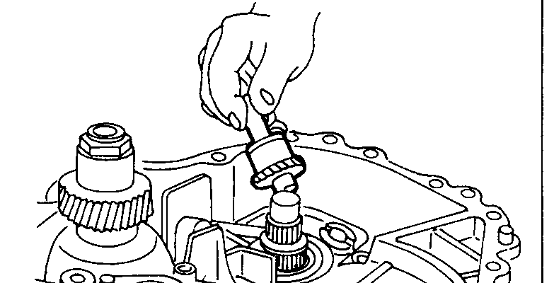 Reverse idle gear being installed by hand into the transmission case.