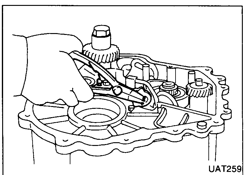 Hand fitting inner circlip onto shift arm inside transmission housing.