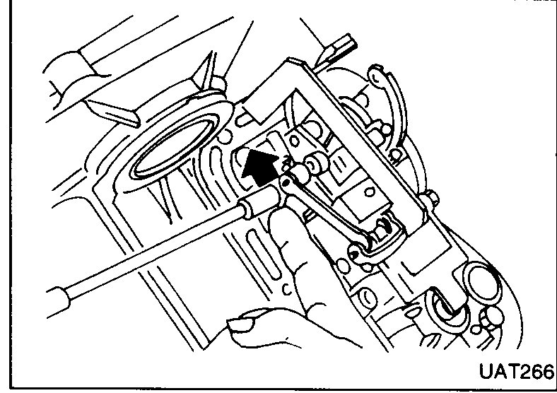 Adjuster plate being pushed in the direction of an arrow on the valve body.