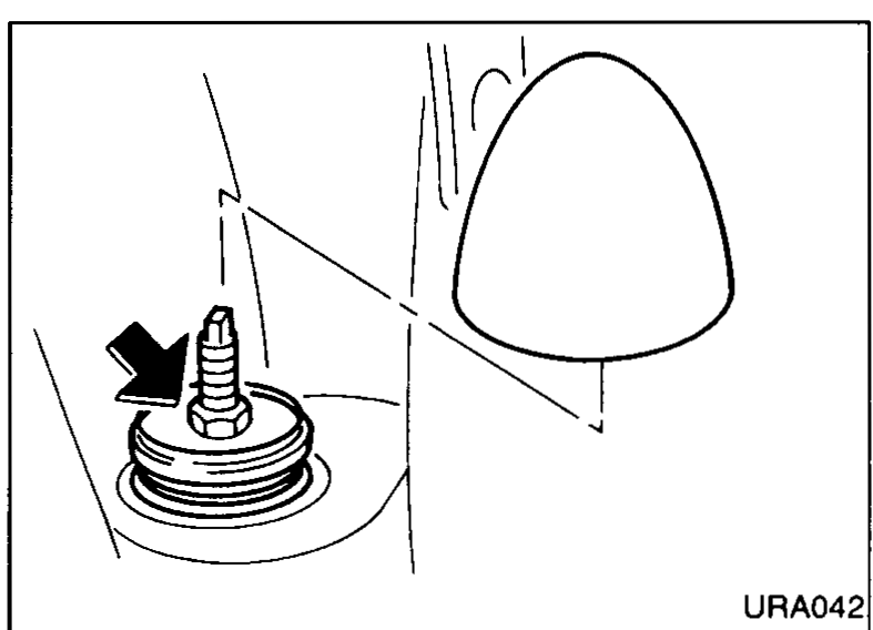 Close-up of a strut upper mount with an arrow indicating the securing-nut location; used to illustrate removal of the strut upper securing nuts and rubber bushes.