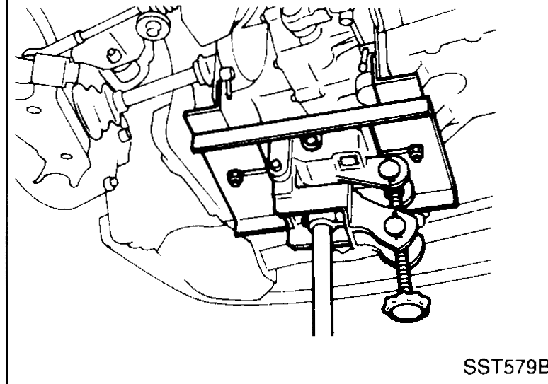 Steering pinion with 'Lower joint tightening bolts' callout and arrow indicating the bolt to slacken.